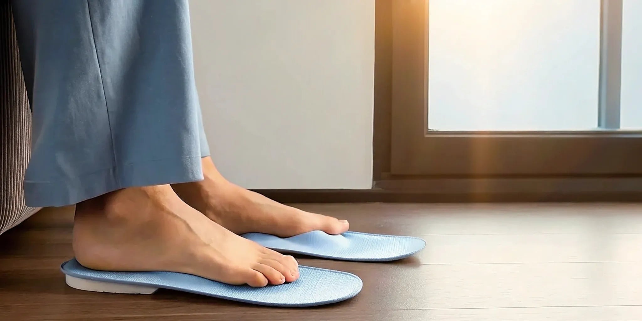 A person's feet on blue plantar fasciitis insoles for all-day standing support.
