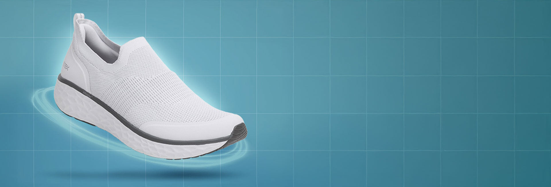 White slip-on shoe with gray accents on a blue grid background