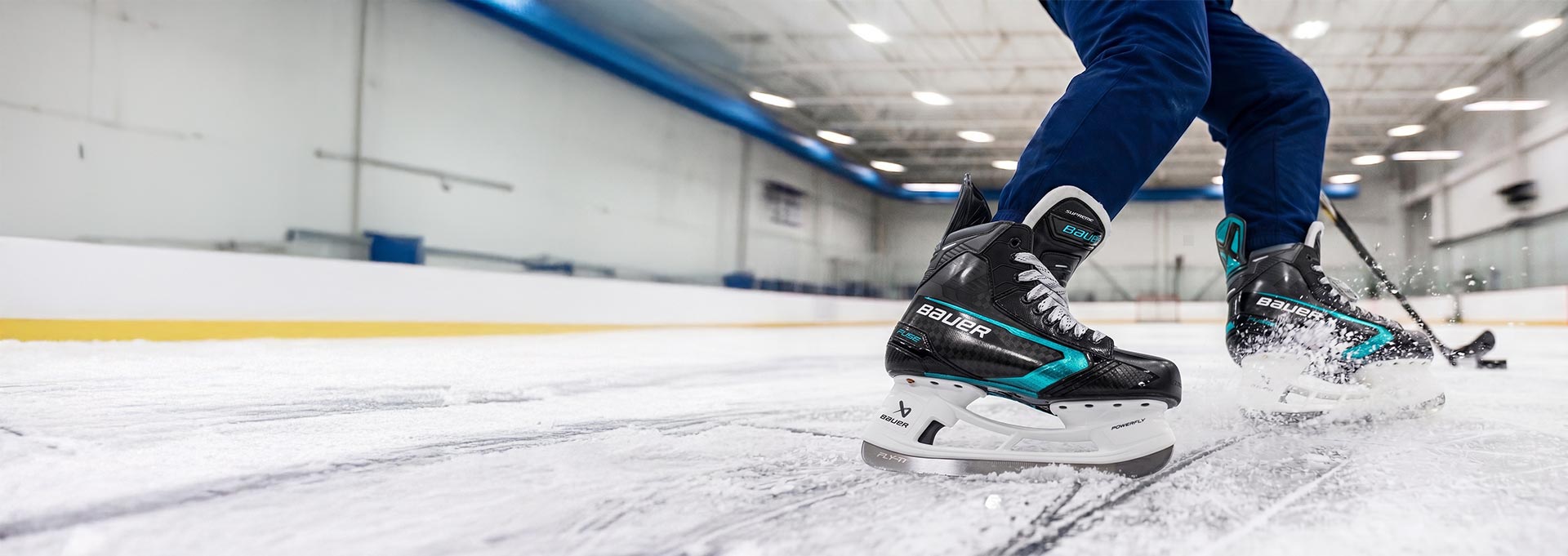 Person wearing ice skates on an indoor ice rink