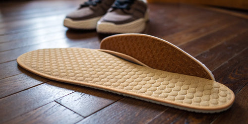 Close-up of the best work insoles for standing all day, showing their deep cushioning and arch support.