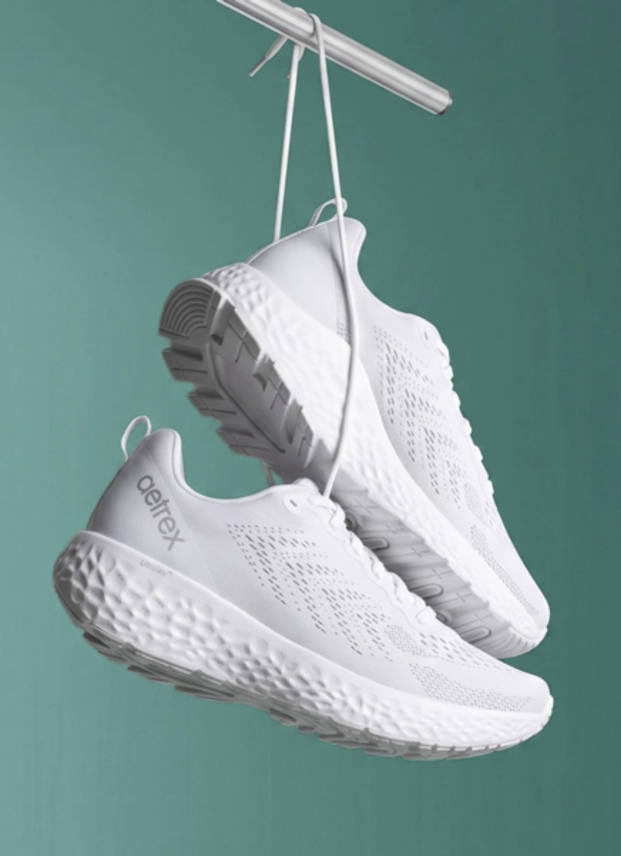 white danika sneaker tied to a metal pole
