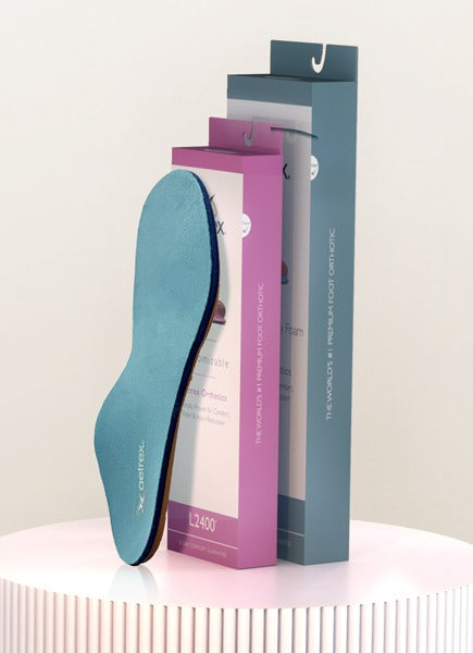 Blue insole with a purple packaging box on a white surface