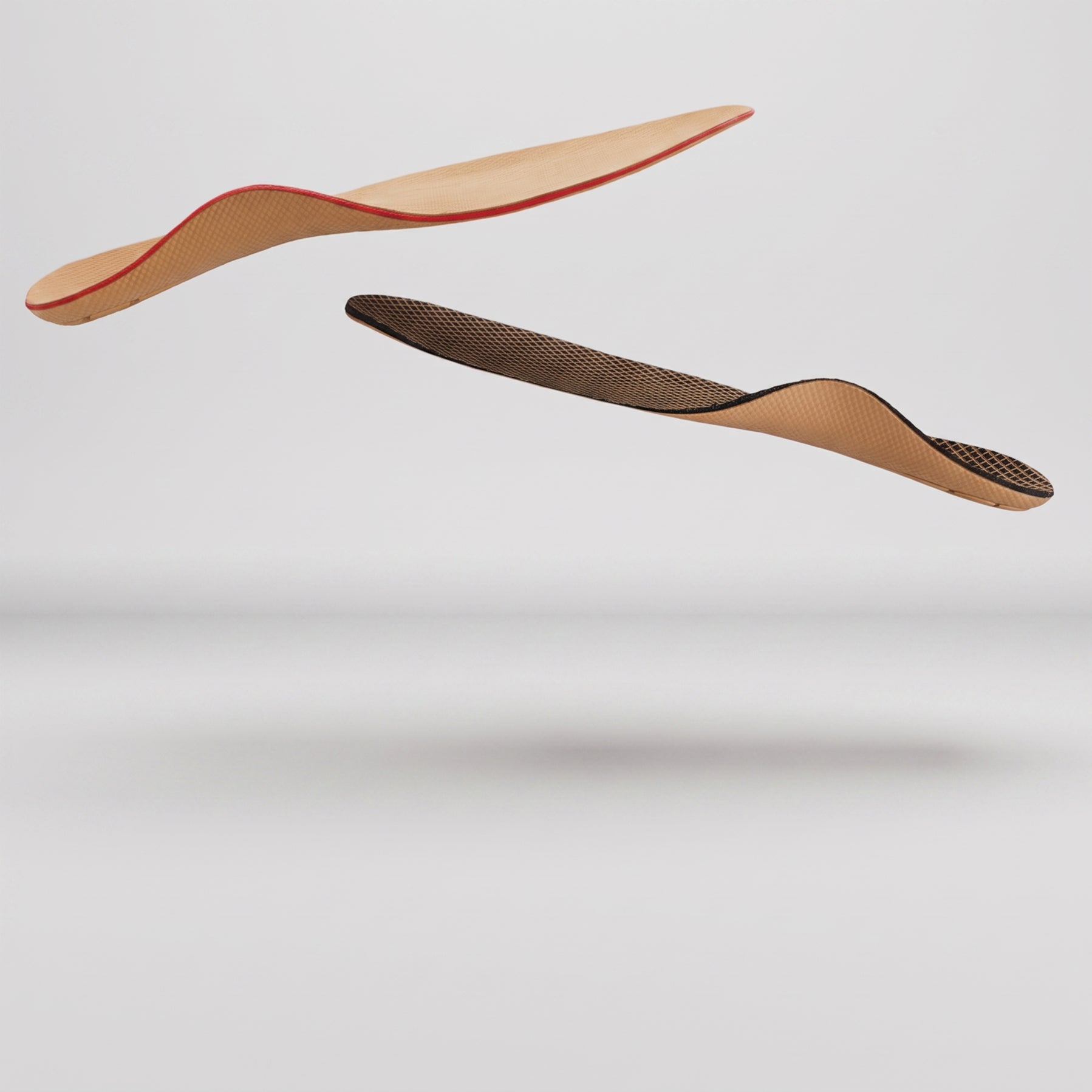 2 orthotics floating to show thickness