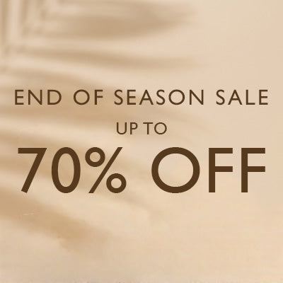 Promotional sale graphic with the text 'END OF SEASON SALE UP TO 70% OFF' in dark brown lettering over a warm beige background with soft shadow-like textures.