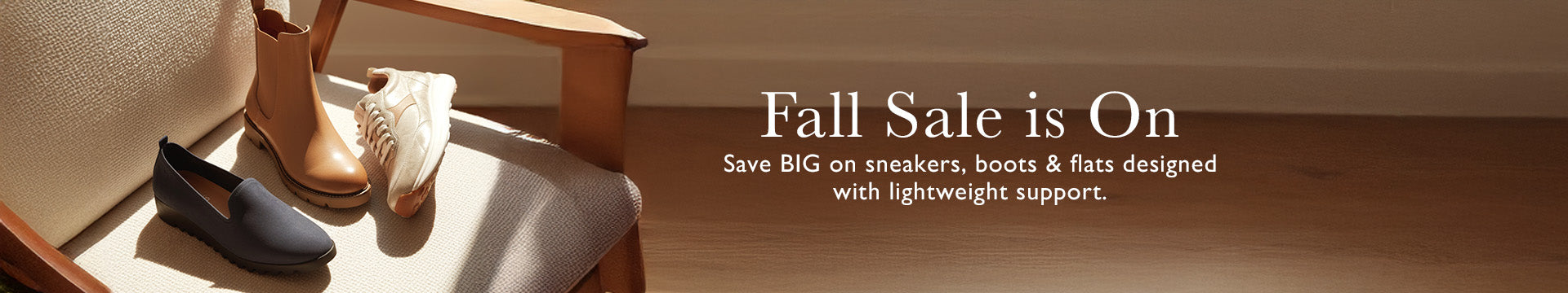 Promotional banner for a fall sale featuring shoes on a wooden floor.