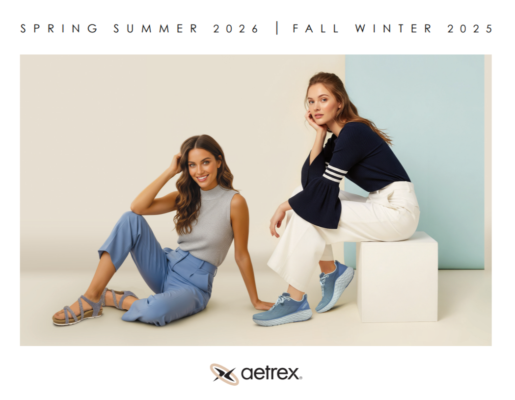 Two women sitting down modeling Aetrex products.