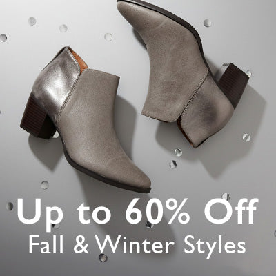Pair of gray ankle boots on a textured surface with promotional text overlay.